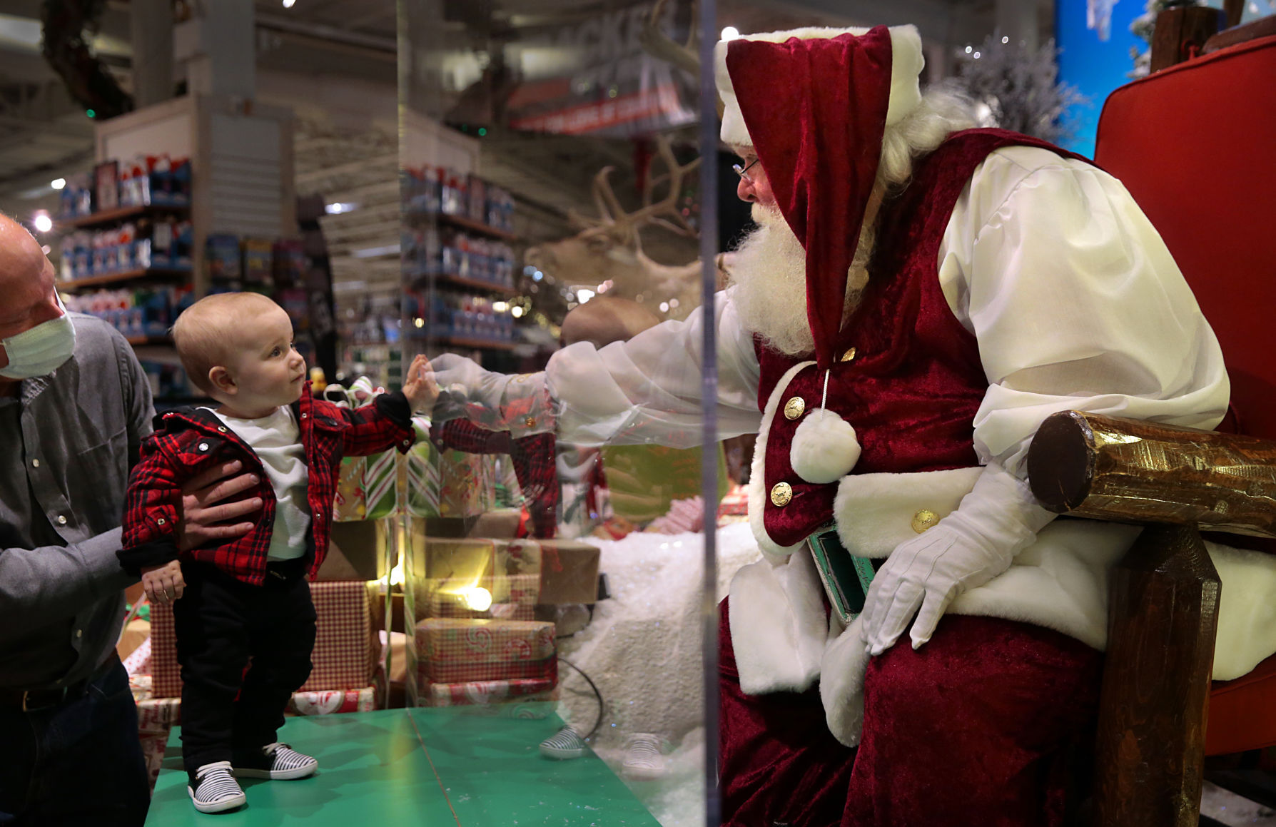 Sanitized Santa appears behind the glass